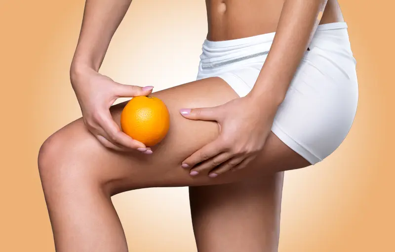 Perfect slim toned young body of brunette sensual girl, fit woman at studio. The fitness, diet, sports, plastic surgery and aesthetic cosmetology concept. Long legs.